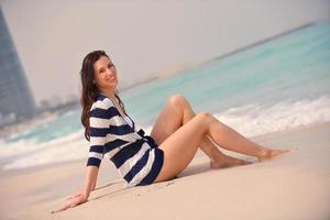 portrait of happy young woman on beach photo