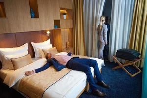 young couple in modern hotel room photo