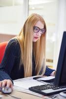 business woman working on computer at office photo