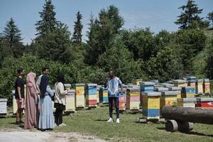 people group visiting local honey production farm photo