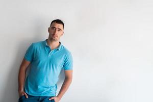 Formal business male portrait. A confident successful casual businessman or manager stands in front of a white background. photo