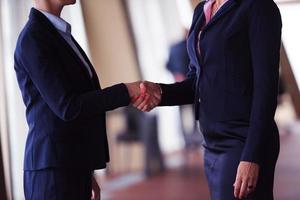 business womans make deal and handshake photo