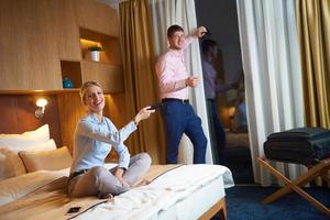 young couple in modern hotel room photo