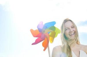 beautiful bride outdoor with colorful windmill toy photo