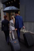 business people couple entering  hotel photo