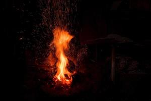 Traditional blacksmith furnace with burning fire photo