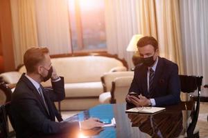 business people wearing crona virus protection face mask on meeting photo