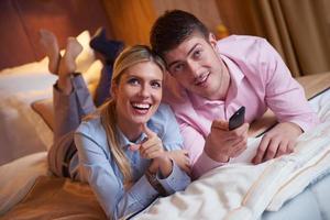 young couple in modern hotel room photo