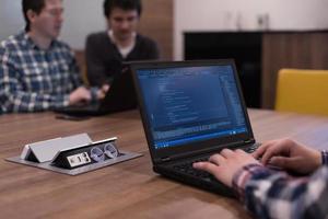 programmer writing programming code photo