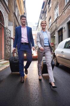 business people couple entering  hotel photo