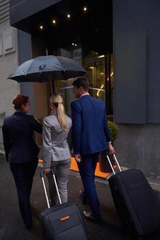 business people couple entering  hotel photo