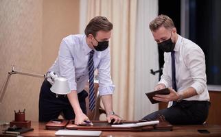 business people wearing crona virus protection face mask on meeting photo