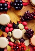 Autumn composition. Backdrop made of autumn berries, autumn berries, macarons. Autumn, fall concept. Flat lay, top view photo