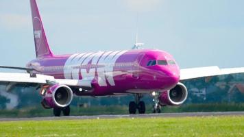 AMSTERDAM, THE NETHERLANDS JULY 26, 2017 - WOW Air Airbus 321 TF JOY braking after landing on runway 18R Polderbaan. Shiphol Airport, Amsterdam, Holland video