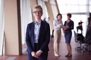 business people group, woman in front  as team leader photo