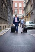 business people couple entering  hotel photo