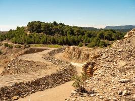 Landscape of an old quarry with mountains on a background photo