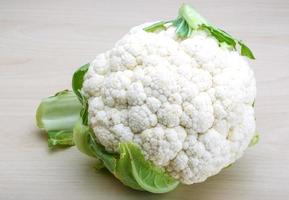 Cauliflower on wooden background photo