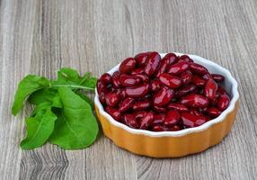 Kidney beans in a bowl on wooden background photo