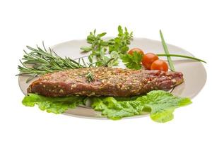 Smoked beef on the plate and white background photo