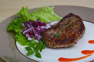 Beefsteak on the plate photo