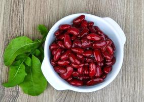 Kidney beans in a bowl on wooden background photo