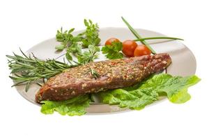 Smoked beef on the plate and white background photo