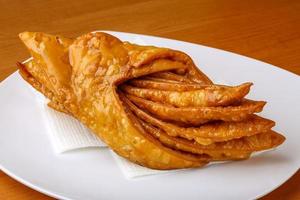 Baklava on the plate and wooden background photo