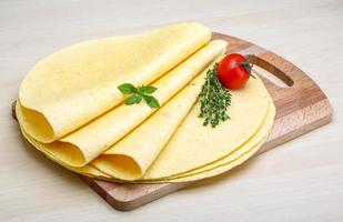 Tortilla on wooden board and wooden background photo