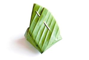 Sweet sticky rice with Thai custard in the banana leaf wrapped photo