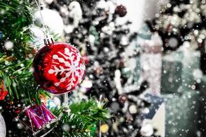 Decorated Christmas tree with colorful bauble on sparkling bokeh light blurred background photo