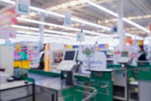 Blur cashier checkout counter in the supermarket photo