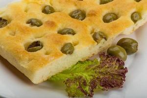 Olive bread on the plate photo