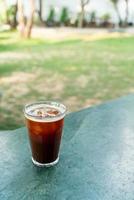 iced americano coffee glass on table photo