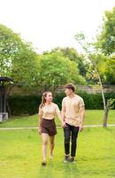 Asian couple love dating in park photo