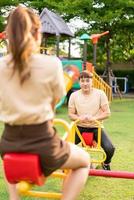 Asian couple love play seesaw photo