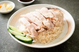 Hainanese chicken rice or rice steamed with chicken soup photo