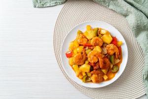 Stir-fried sweet and sour with fried shrimp photo