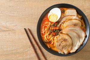 Ramen Noodles Spicy Tomyum Soup with Roast Pork photo