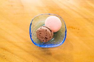 rose and chocolate macaron on plate photo