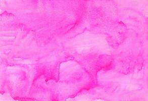 Watercolor pink background hand painted. Aquarelle bright pink stains on paper. photo