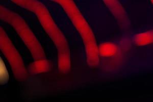 Red Defocus Abstract bokeh light effects on the night black background texture photo