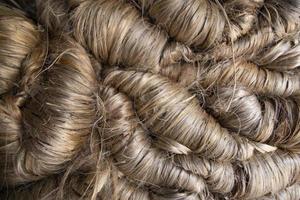 A thick bundle of Golden jute fiber Texture Background photo