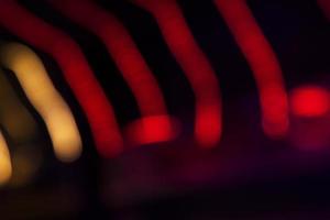 Red Defocus Abstract bokeh light effects on the night black background texture photo