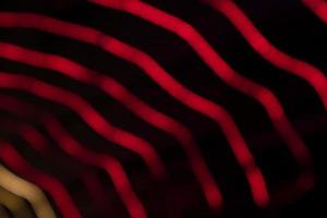 Red Defocus Abstract bokeh light effects on the night black background texture photo