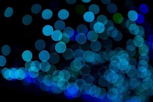 Blue Defocus Abstract bokeh light effects on the night black background texture photo