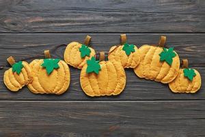 Ready-made garland of decorative felt pumpkins for home decoration. Autumn or Halloween decor photo