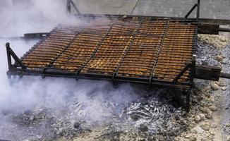 Grilling sausage with fire photo