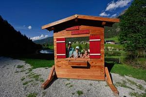 Children in wooden photo zone at Untertauern wildpark, Austria.