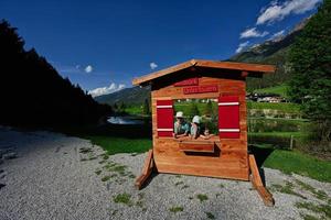 Children in wooden photo zone at Untertauern wildpark, Austria.